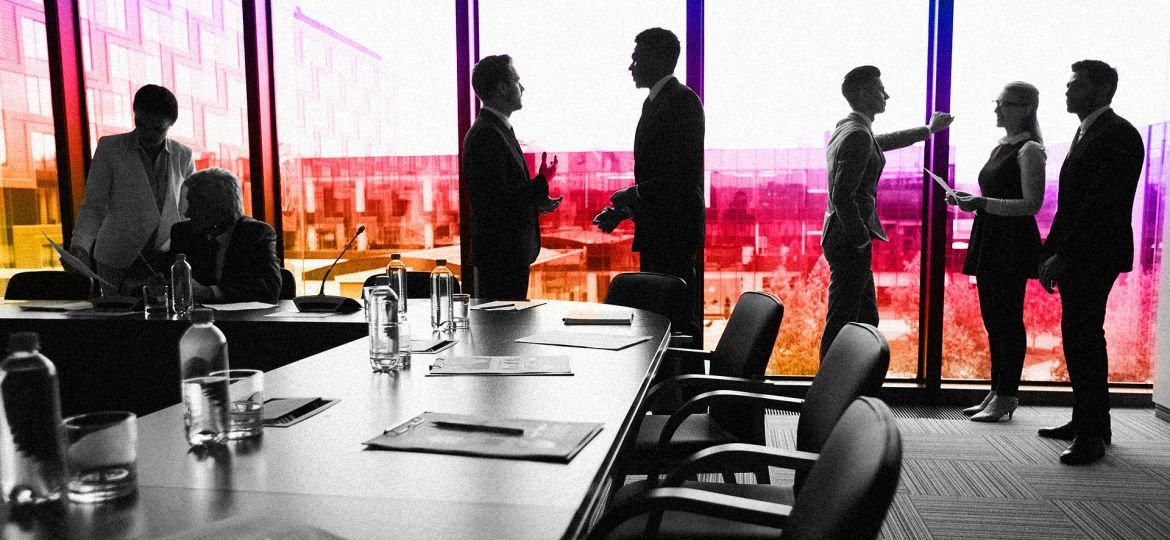 corporate board room with executives discussing future of brand